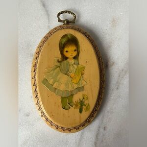 Vintage oval wooden picture of little girl